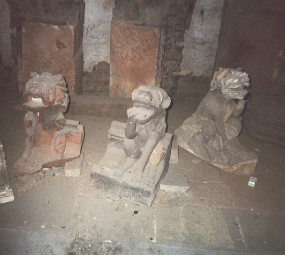 Set of gargoyles from Strasbourg Cathedral being restored  inside Fortress Bridge in Strasbourg, photograph by C. W. Booth